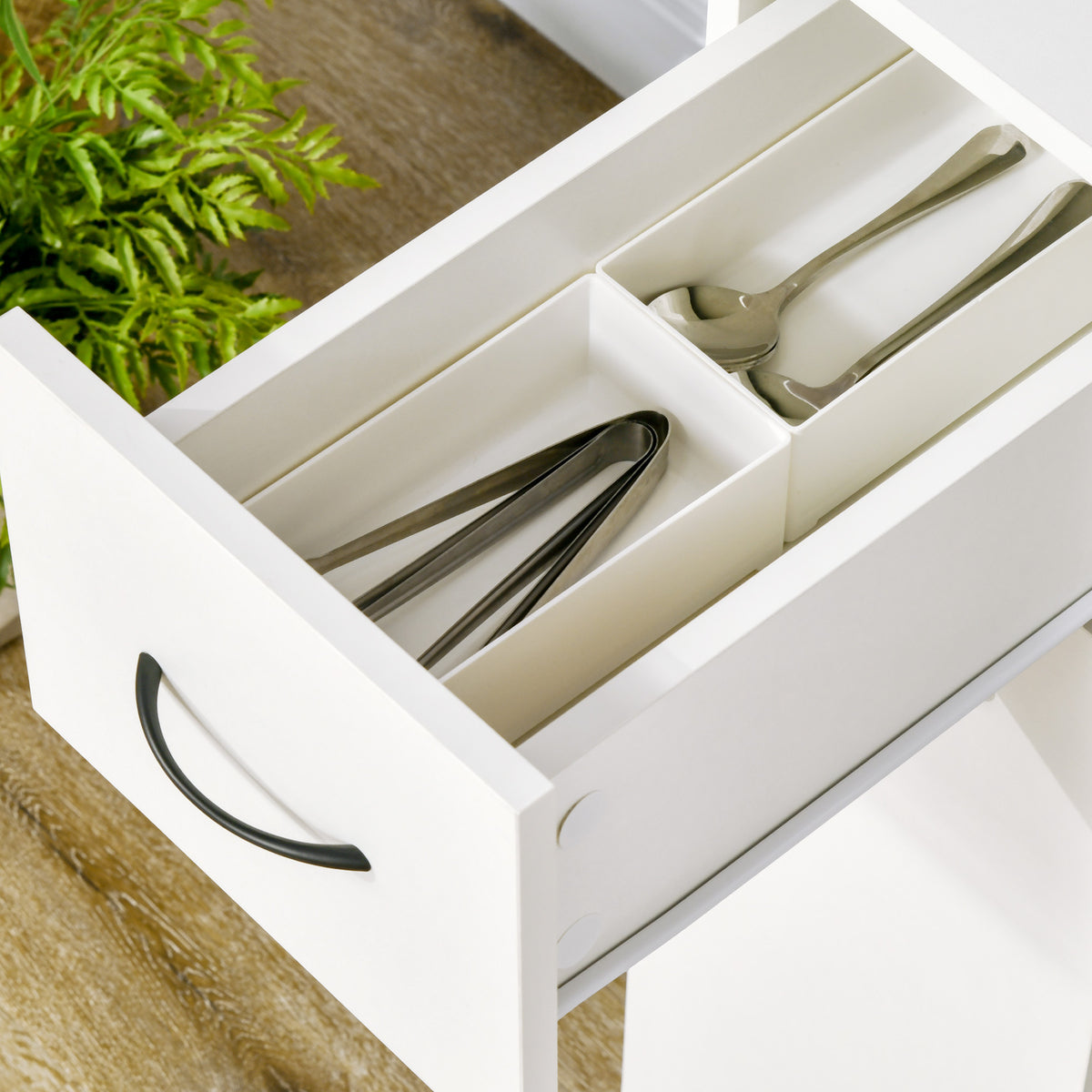 slim rolling storage cart with drawer in white, open drawer organizing utensils and kitchen items in narrow space