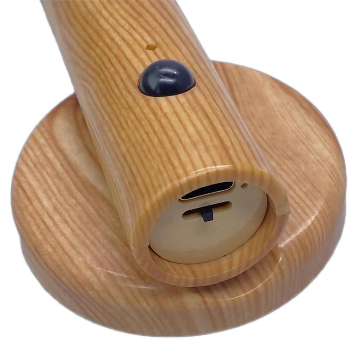 Rechargeable motion sensor night light with wood finish showing motion sensor dome and charging port