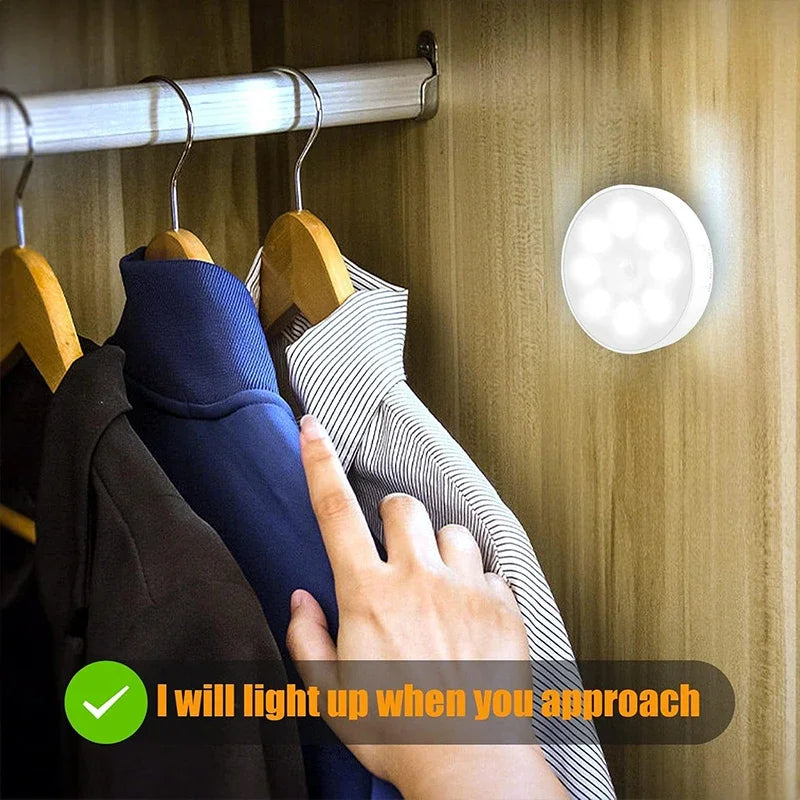 Motion sensor night light lighting up inside a closet as someone approaches.