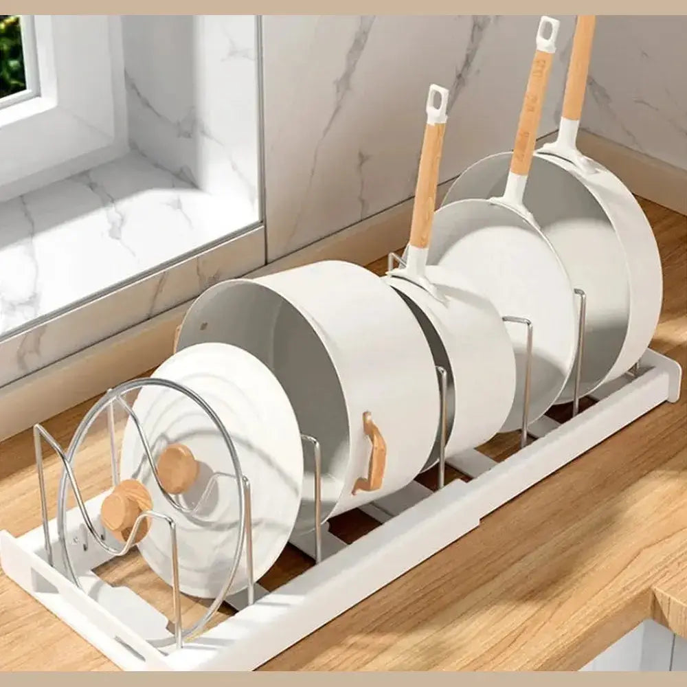 Adjustable pot and pan organizer displaying upright cookware on a kitchen countertop.