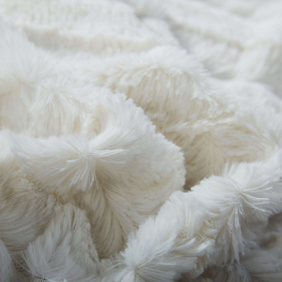 Faux fur sherpa throw blanket in white ivory showing plush silky faux fur texture detail
