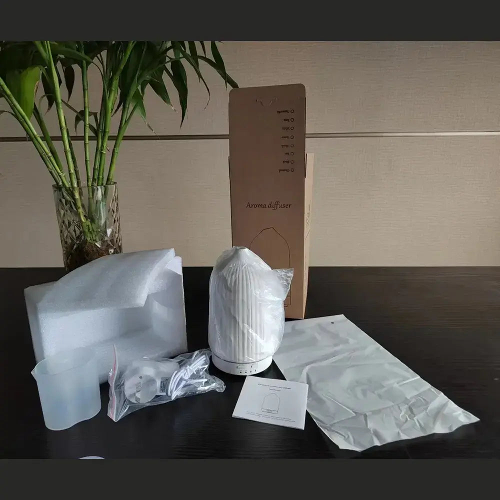 Ceramic essential oil diffuser shown with its retail packaging