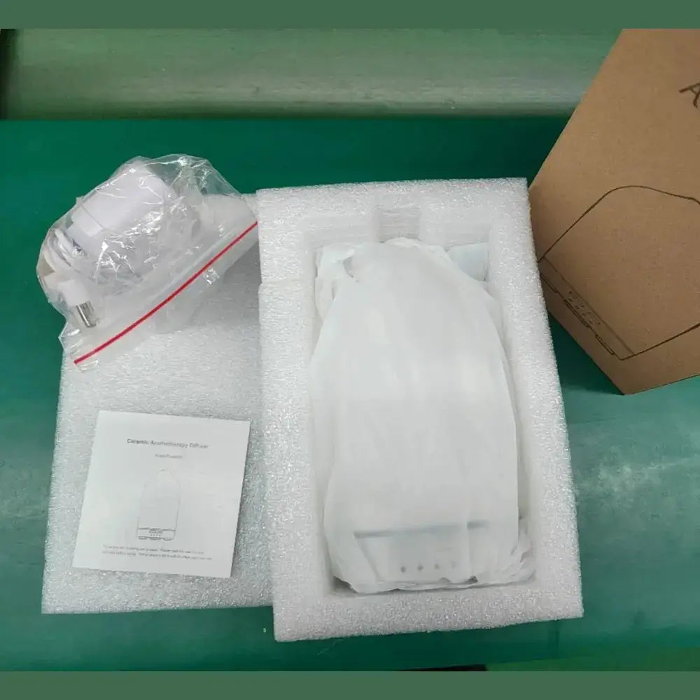 Ceramic essential oil diffuser shown being unboxed
