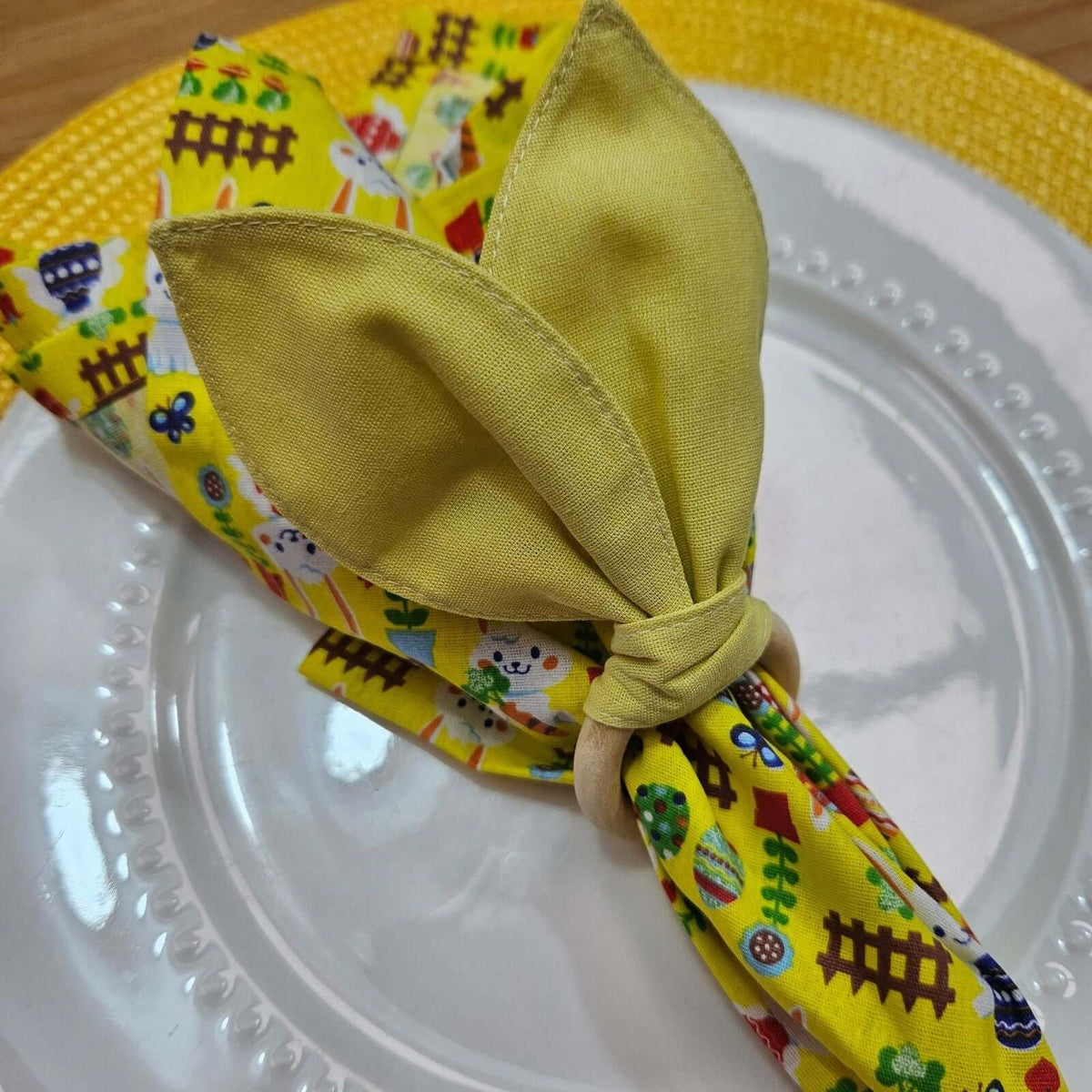 Set of soft cotton napkins with an Easter bunny motif for spring tables, machine washable and reusable.