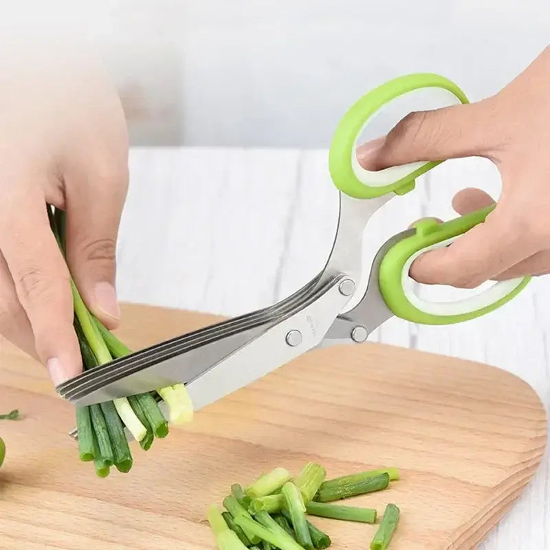 Five Blade Stainless Steel Herb Scissors cutting green onions on a wooden board.