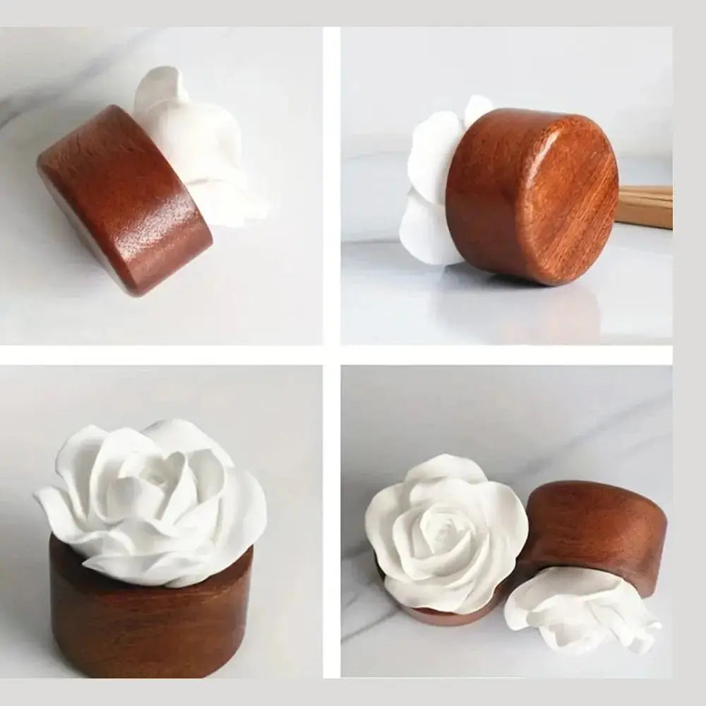 Flower aroma diffuser for home with ceramic rose on wooden base.