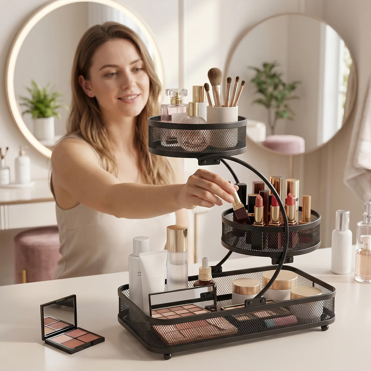 3-tier metal bathroom organizer with hooks holding makeup, brushes, and skincare bottles on bathroom counter