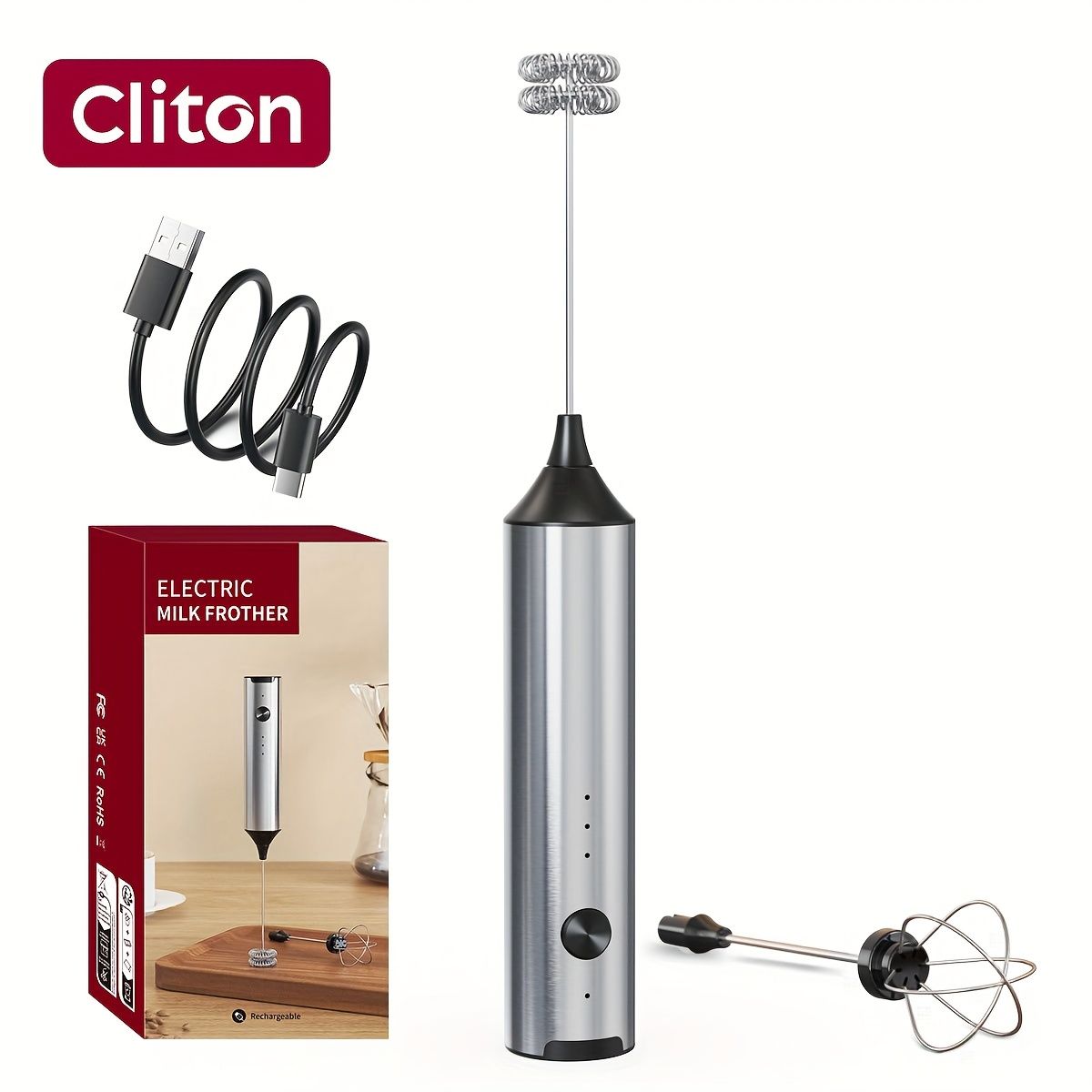 Rechargeable handheld milk frother in stainless steel with two interchangeable whisk heads and USB charging cable
