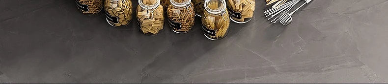 Pull-Out Cabinet Organizer with Sliding Baskets, 600–800 mm with jars and utensils on a countertop.
