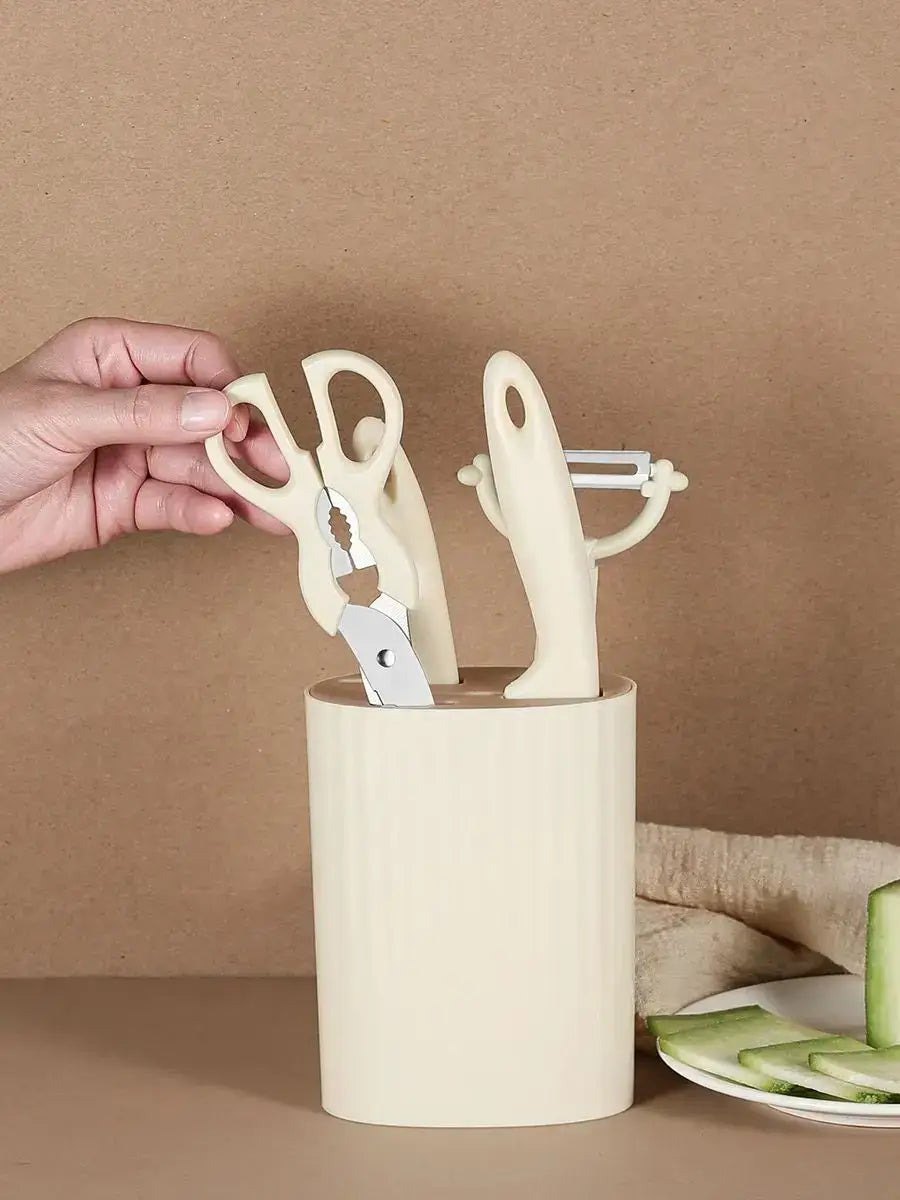 5-piece kitchen knife set with scissors and peeler stored in a stylish countertop block for easy access.