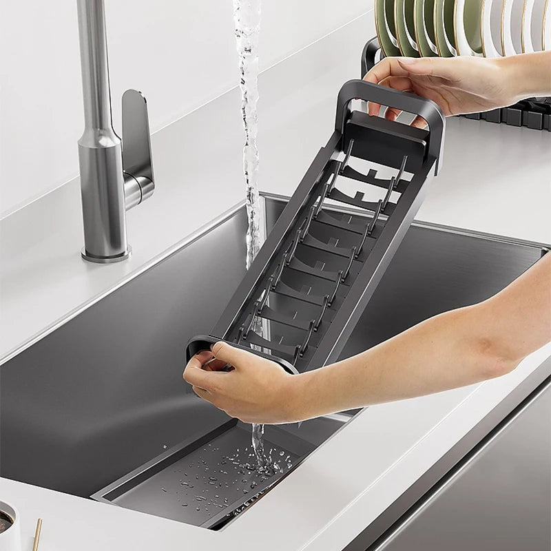 Pull-Out Cabinet Organizer with Sliding Baskets, 600–800 mm being used to wash dishes in a sink.