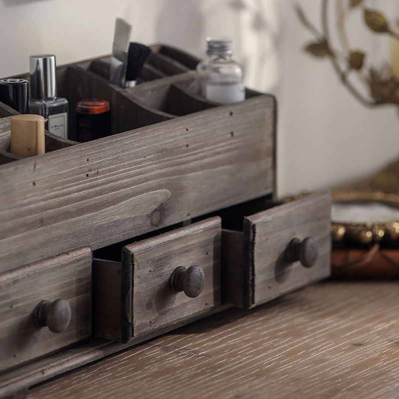 rustic wooden desk organizer with drawers displaying cosmetics and desk essentials in organized compartments