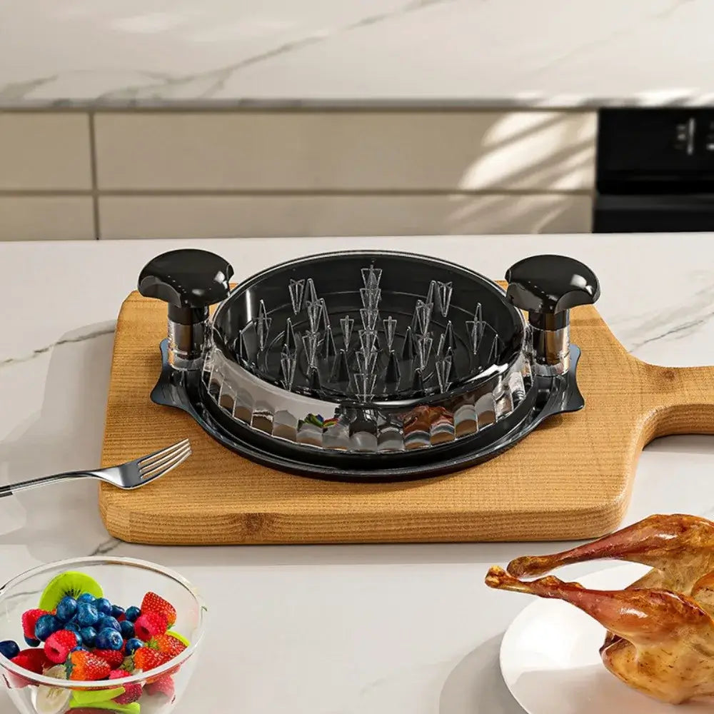 Manual Meat Shredder for Chicken and Beef on a cutting board with chicken drumsticks and berries in a bowl.