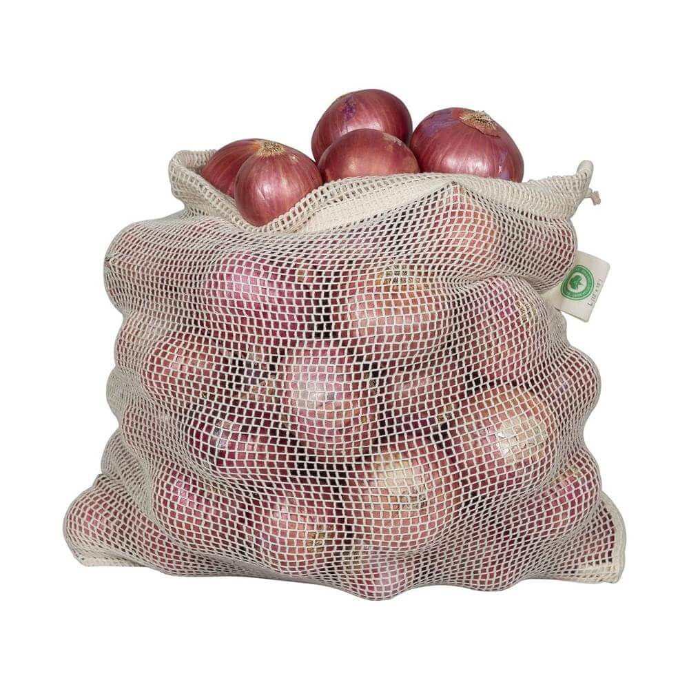Organic cotton produce bags filled with fresh onions, reusable and breathable for bulk shopping.