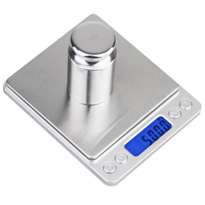 Precision digital kitchen scale with 0.1g readability and a tare function.