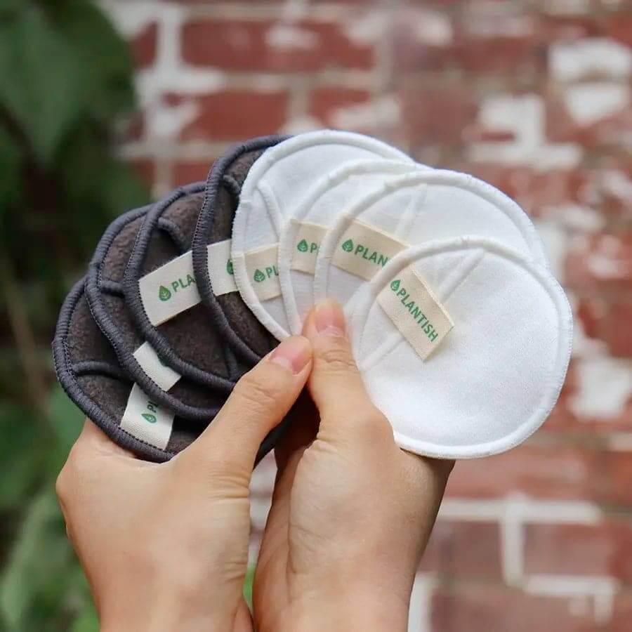 Reusable cotton and bamboo facial rounds packaged with a mesh laundry bag.