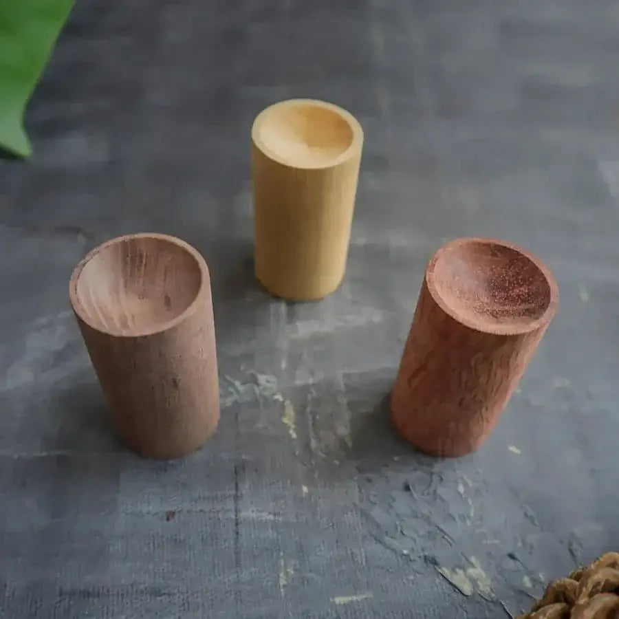 Portable essential oil diffuser with a natural wooden design for aromatherapy on the go.