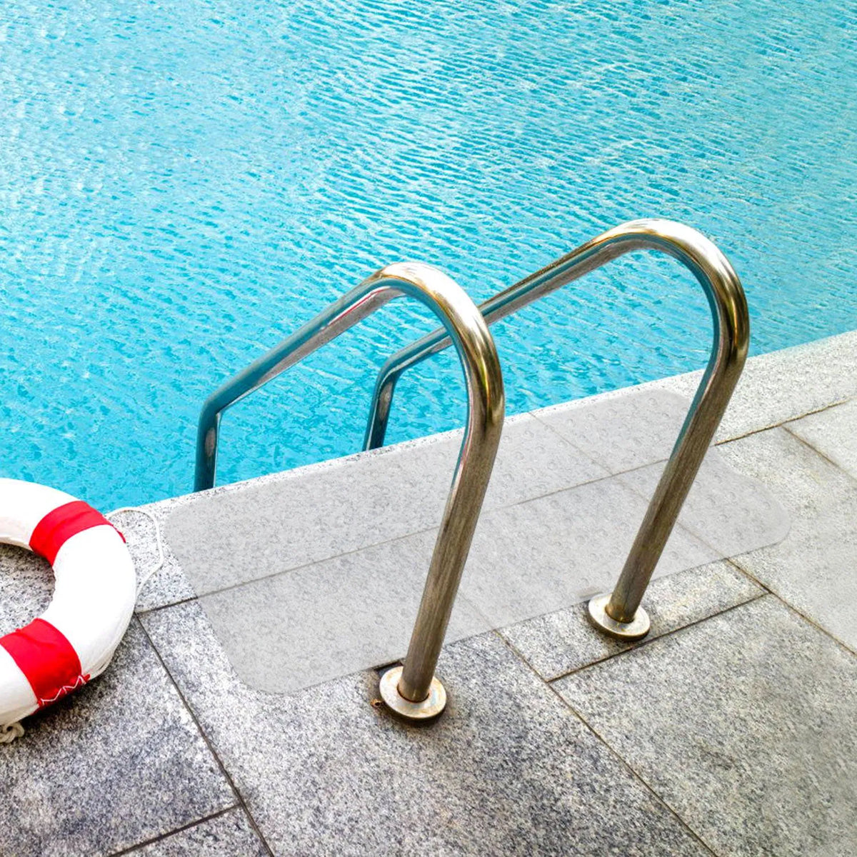 non-slip tub mat with suction cups gripping wet pool deck surface near water