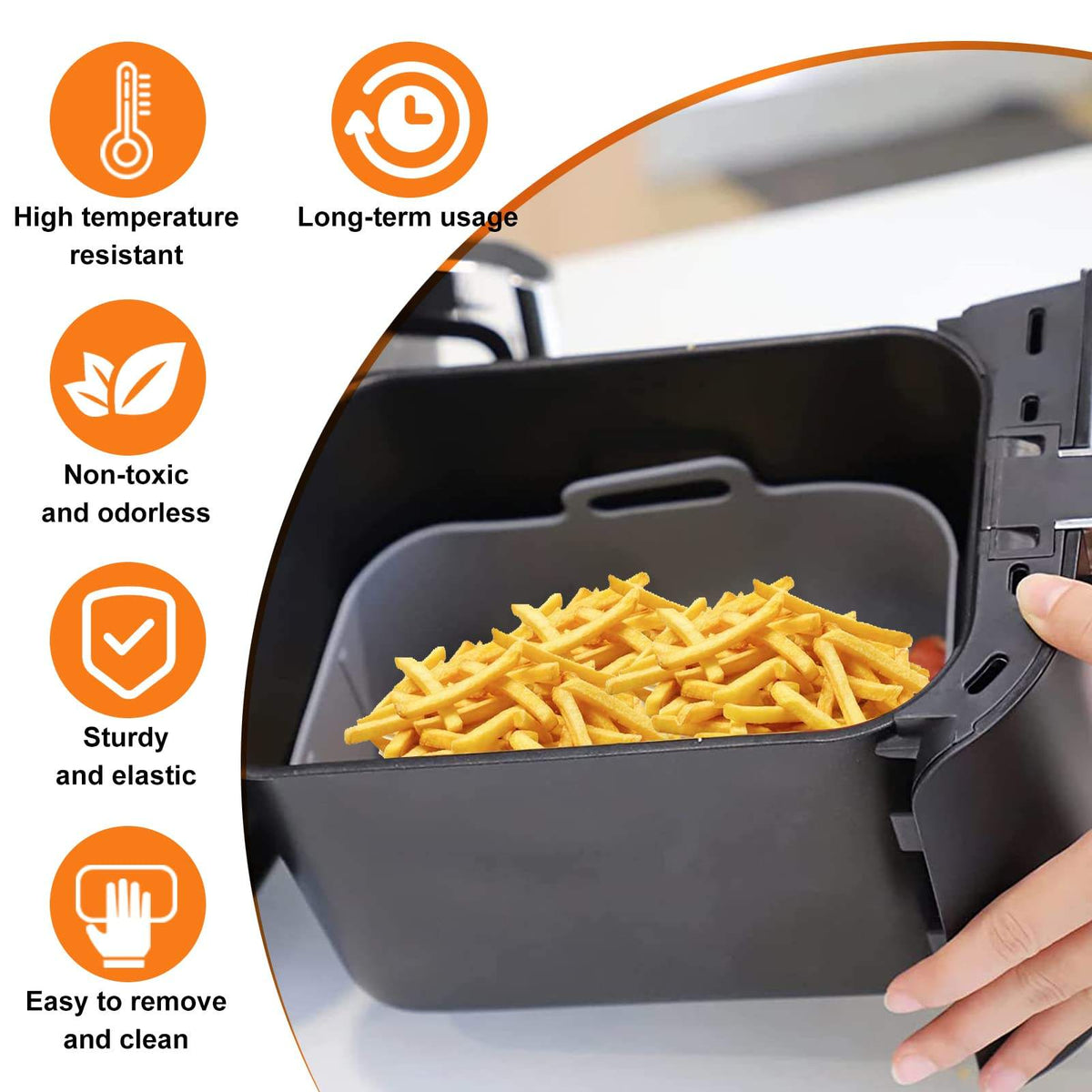 Rectangular silicone air fryer liner with handles holding fries in an air fryer basket