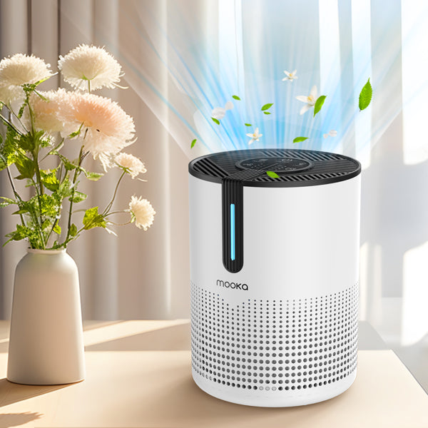 Compact HEPA air purifier with sleep mode on nightstand next to flowers, purifying air quietly