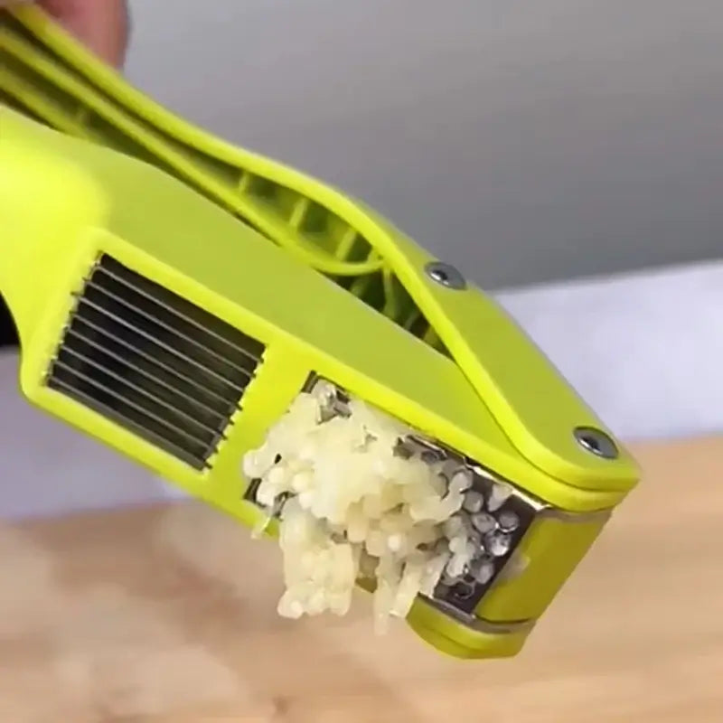 2-in-1 Garlic Press and Slicer, Green Options showing minced garlic ready for use in sauces and marinades.