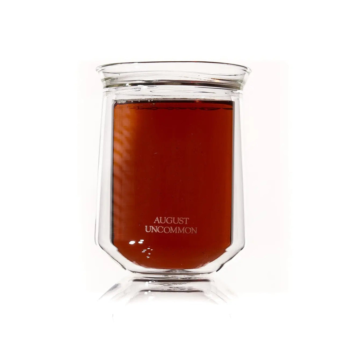 Double-wall glass tea cup filled with brewed tea from the Tea for Two set