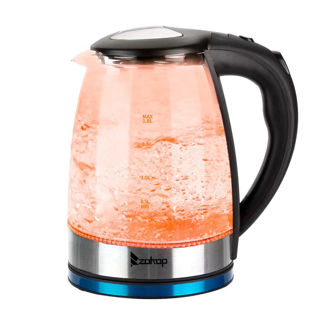 Glass electric kettle glowing orange while heating
