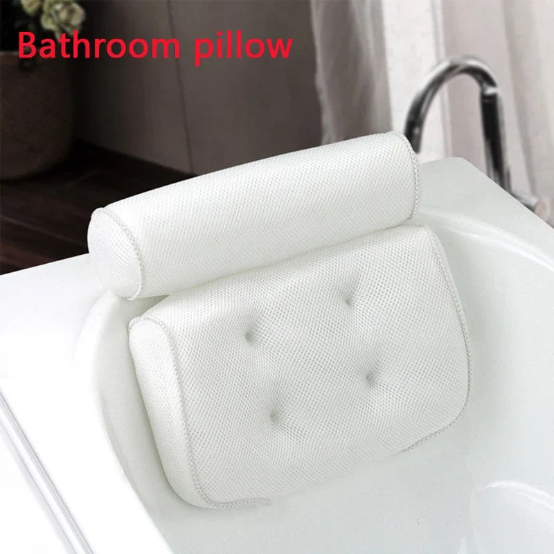 White 3D mesh spa bath pillow with back support and suction cups resting on bathtub edge