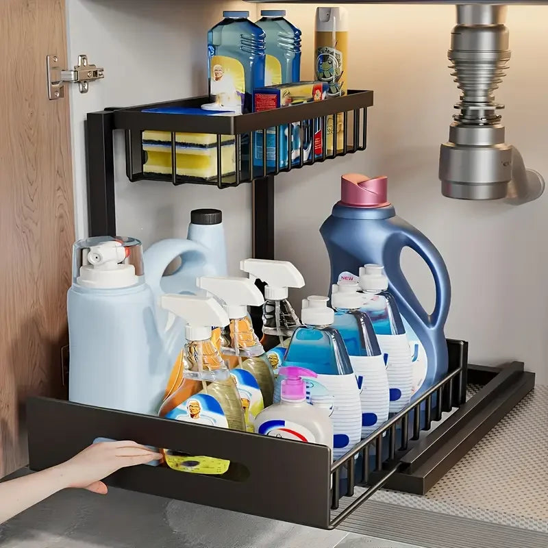 pull-out under-sink organizer with 2-tier black metal baskets storing cleaning supplies and bottles