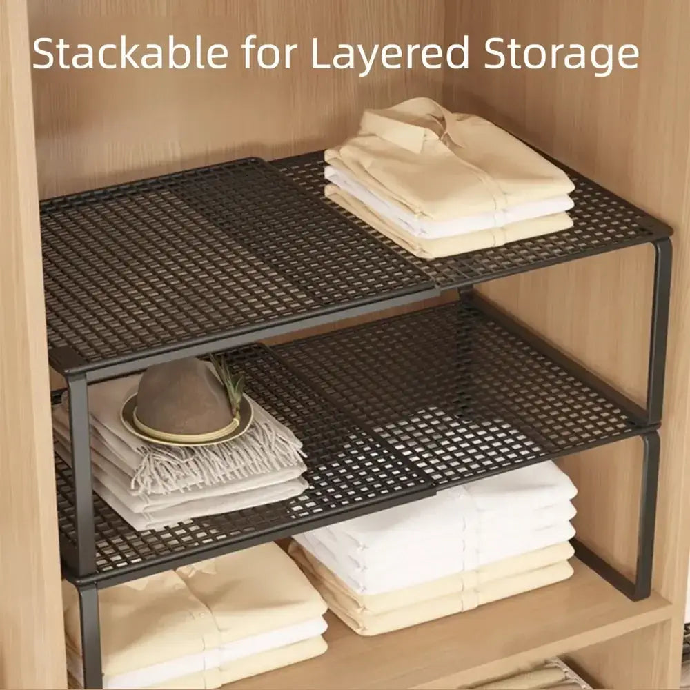 Adjustable closet shelf organizer with stacked layers of folded clothes for efficient storage.