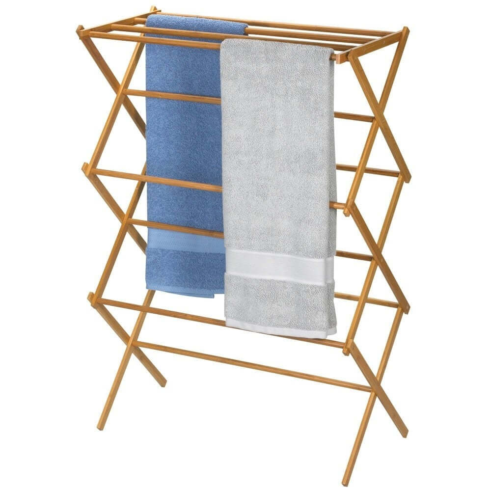 Bamboo folding clothes drying rack, fully opened for air-drying laundry.
