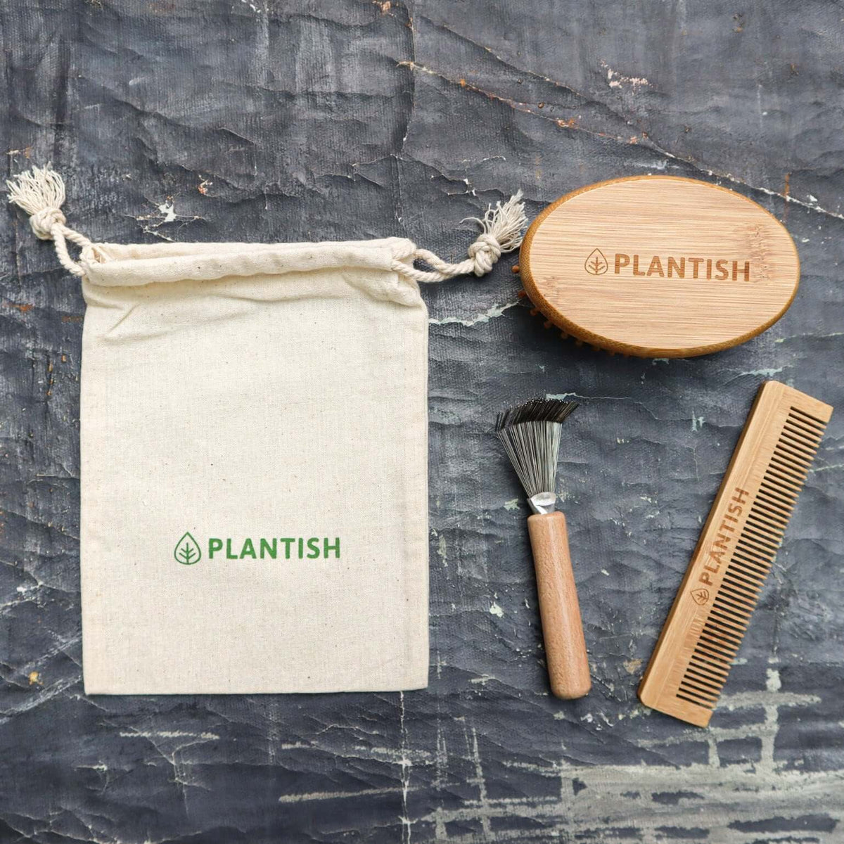 Bamboo comb from the travel hair care kit shown beside its brush.