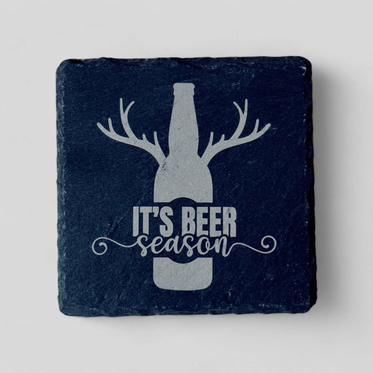 Set of 4-inch square slate coasters with "It's Beer Season" engraving and non-slip backing.