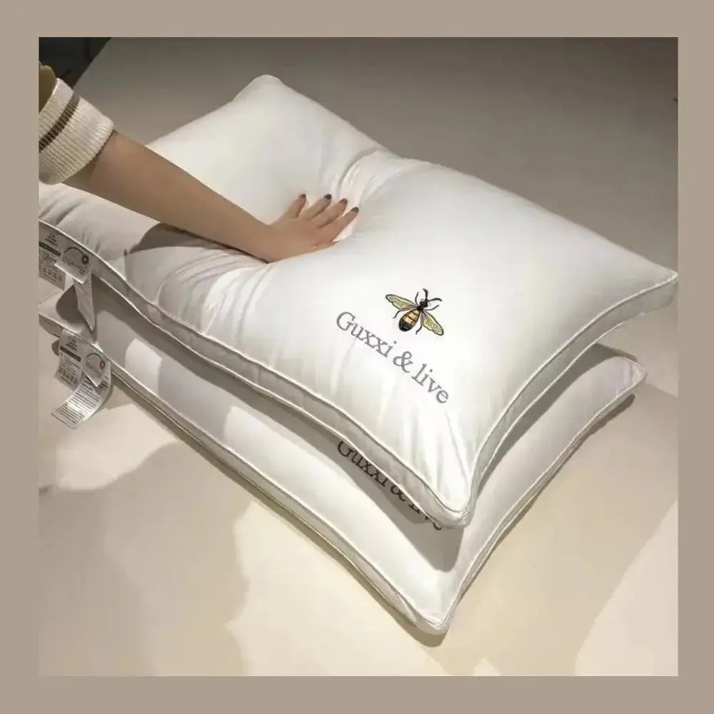 Cervical massage pillow shown with a hand pressing into the contoured neck support area.