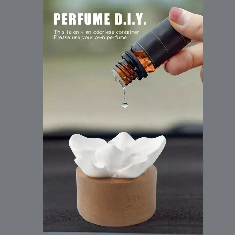 Flower aroma diffuser for home showcasing a DIY perfume setup with a dropper and ceramic floral design.