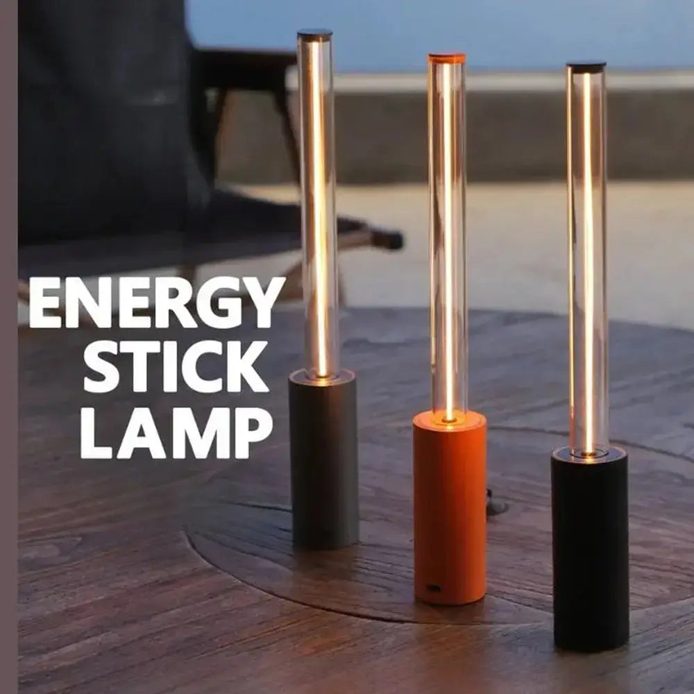 Rechargeable LED night light geometric bar in three colors, illuminating an outdoor table with a warm glow.