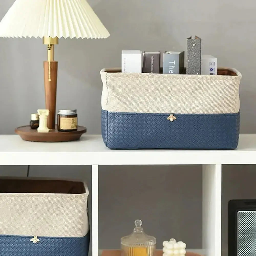 Foldable storage basket with metal frame, stylishly organizing items on a shelf, perfect for keeping spaces tidy.