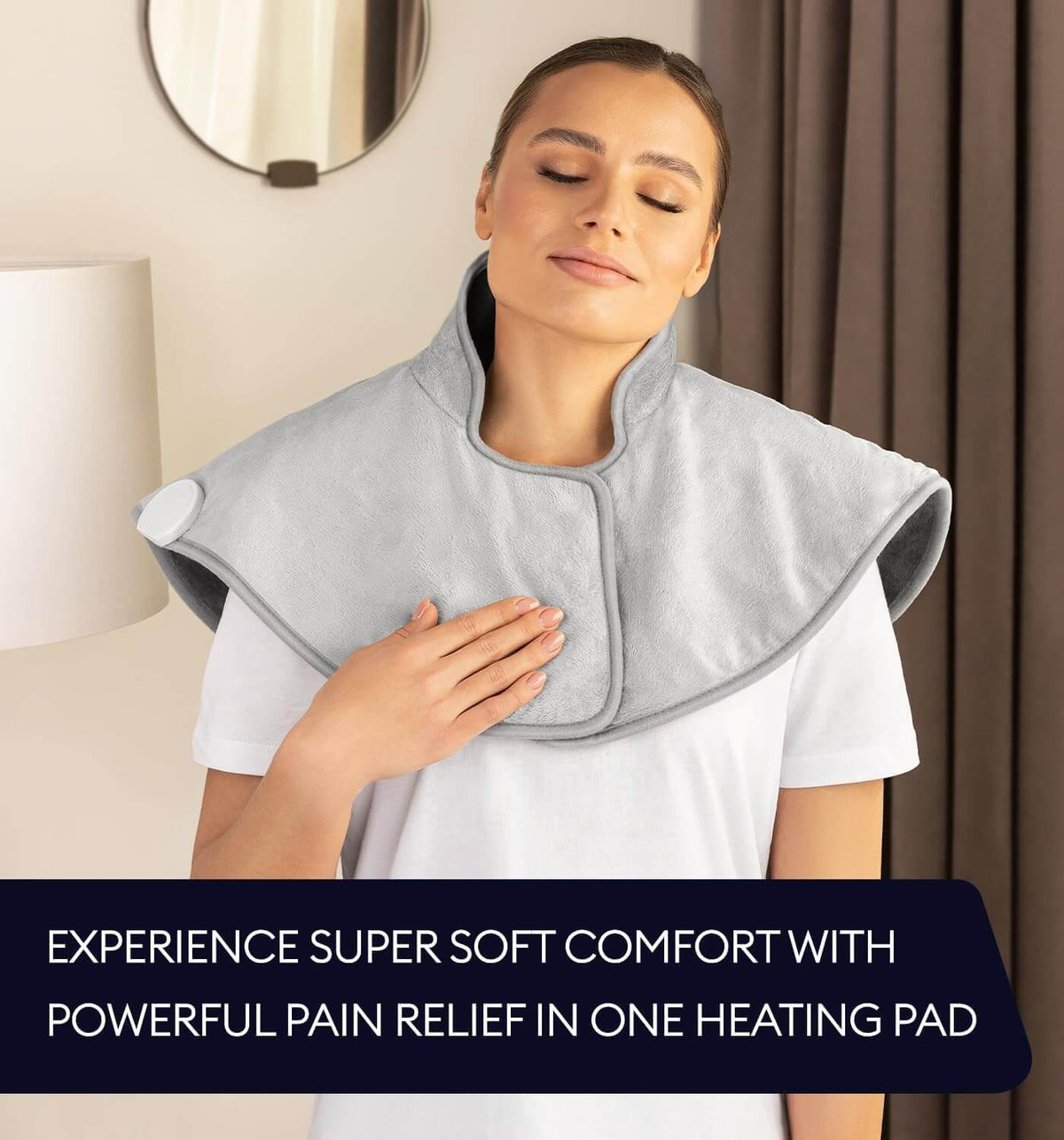 Geniani neck and shoulder heating wrap in Mist Gray worn by woman, showing plush fabric and adjustable front strap