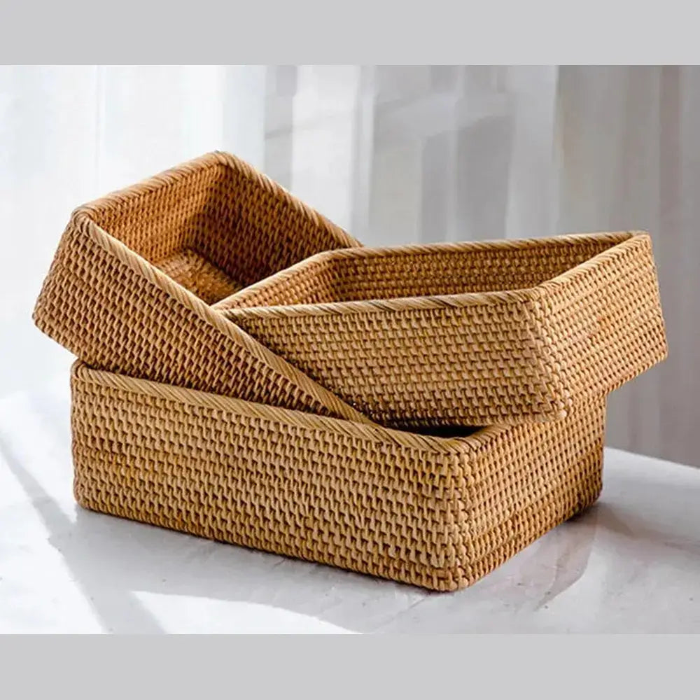 Handwoven rattan storage basket shown empty, highlighting its rectangular wicker weave.