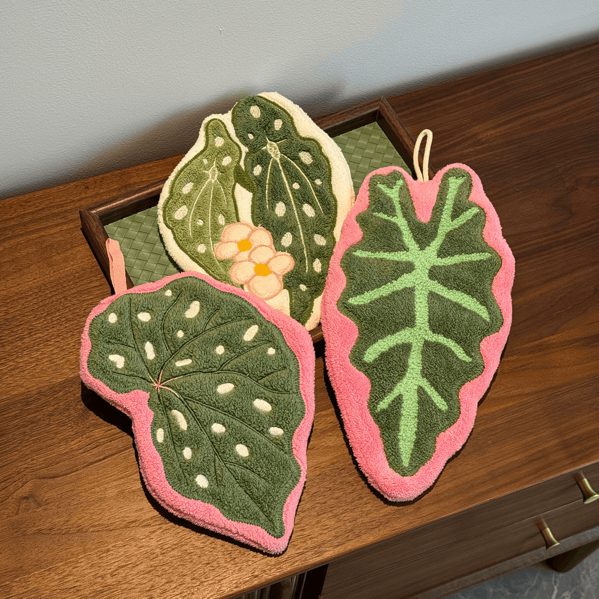 Set of three hanging hand towels with a botanical leaf embroidery design.