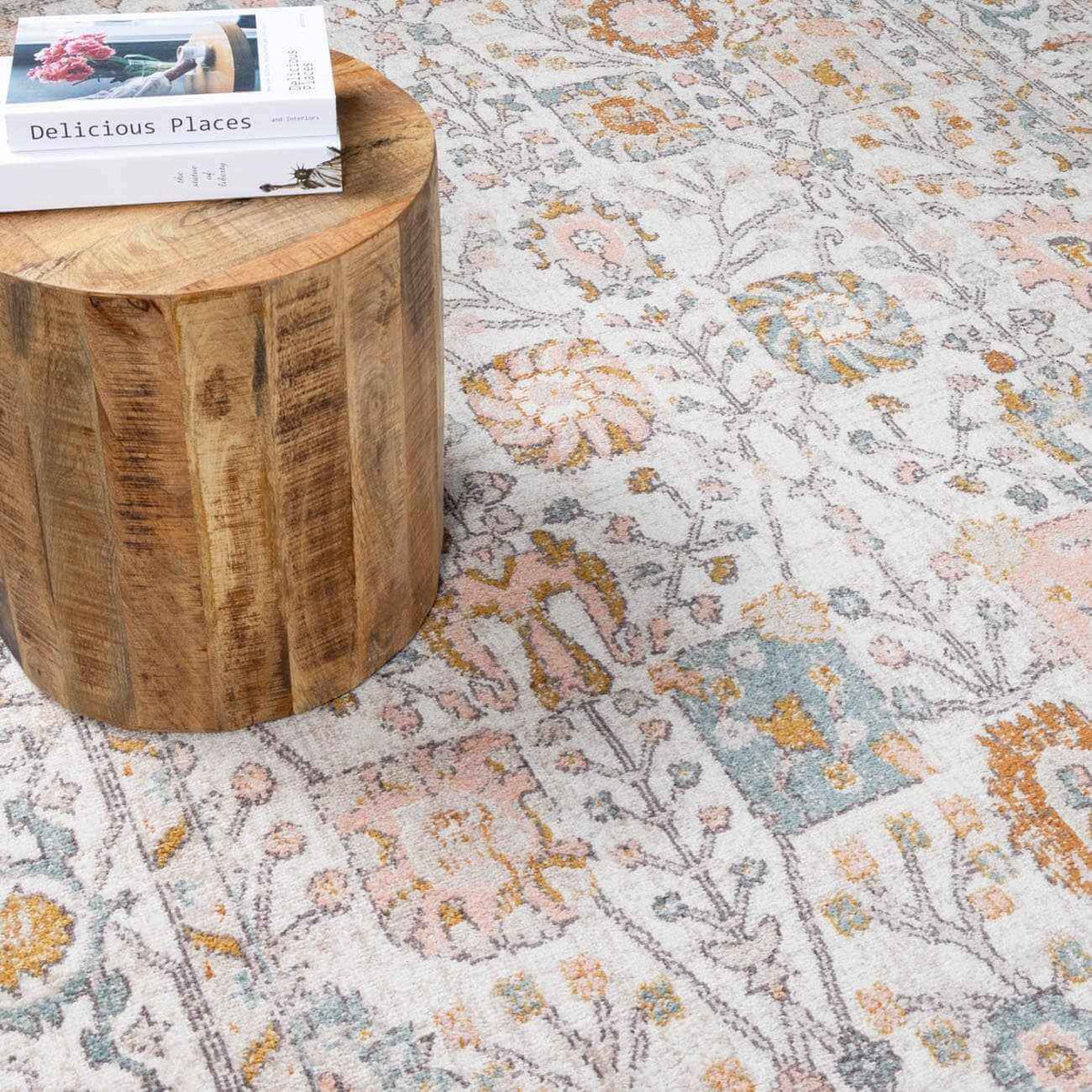 Elegant area rug displayed under a wooden table with a book, enhancing the modern home decor.