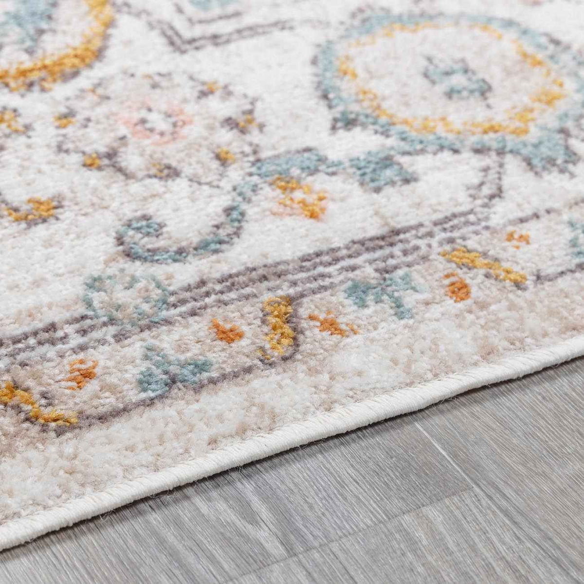 Elegant area rug featuring intricate floral patterns on a soft, plush surface.