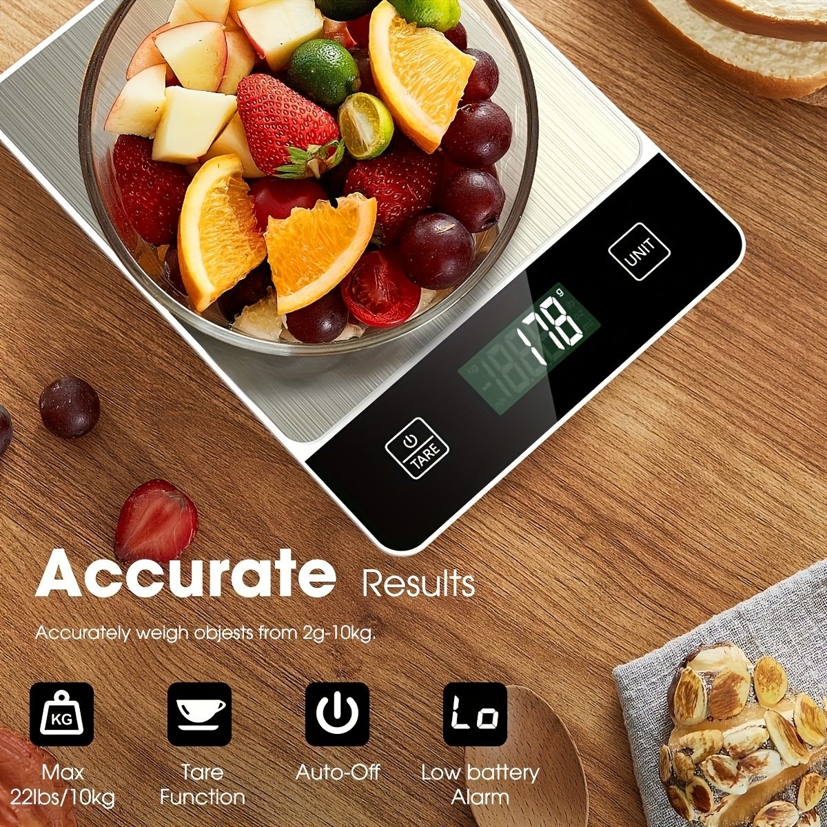 Digital kitchen scale 22 lb weighing fresh fruit in stainless steel bowl with digital display showing 718g