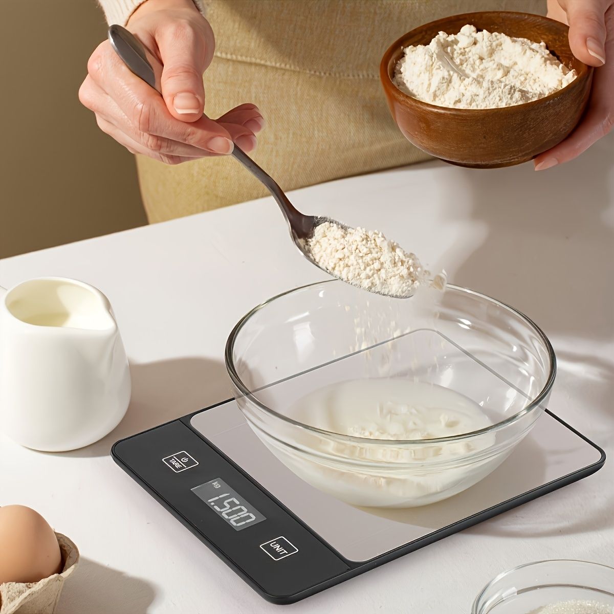 digital kitchen scale 22 lb with flour in bowl for baking, stainless steel surface and digital display