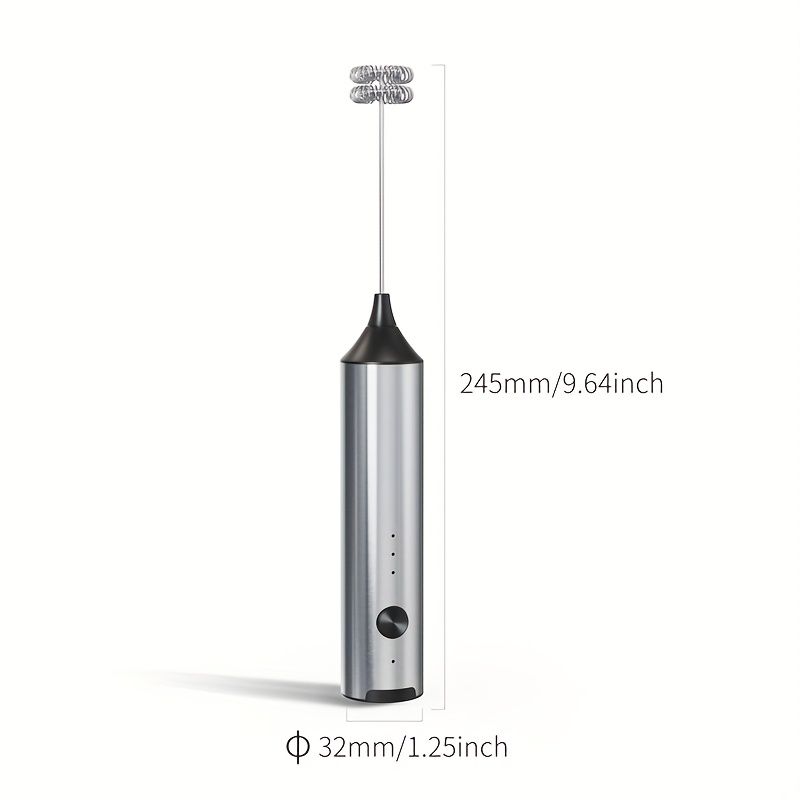 Rechargeable handheld milk frother in silver with black top, showing two interchangeable whisk heads and compact design dimensions