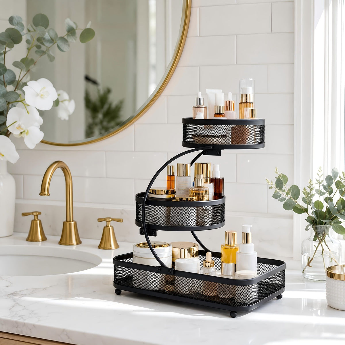 Black 3-tier metal bathroom organizer with hooks holding makeup, skincare bottles on bathroom countertop