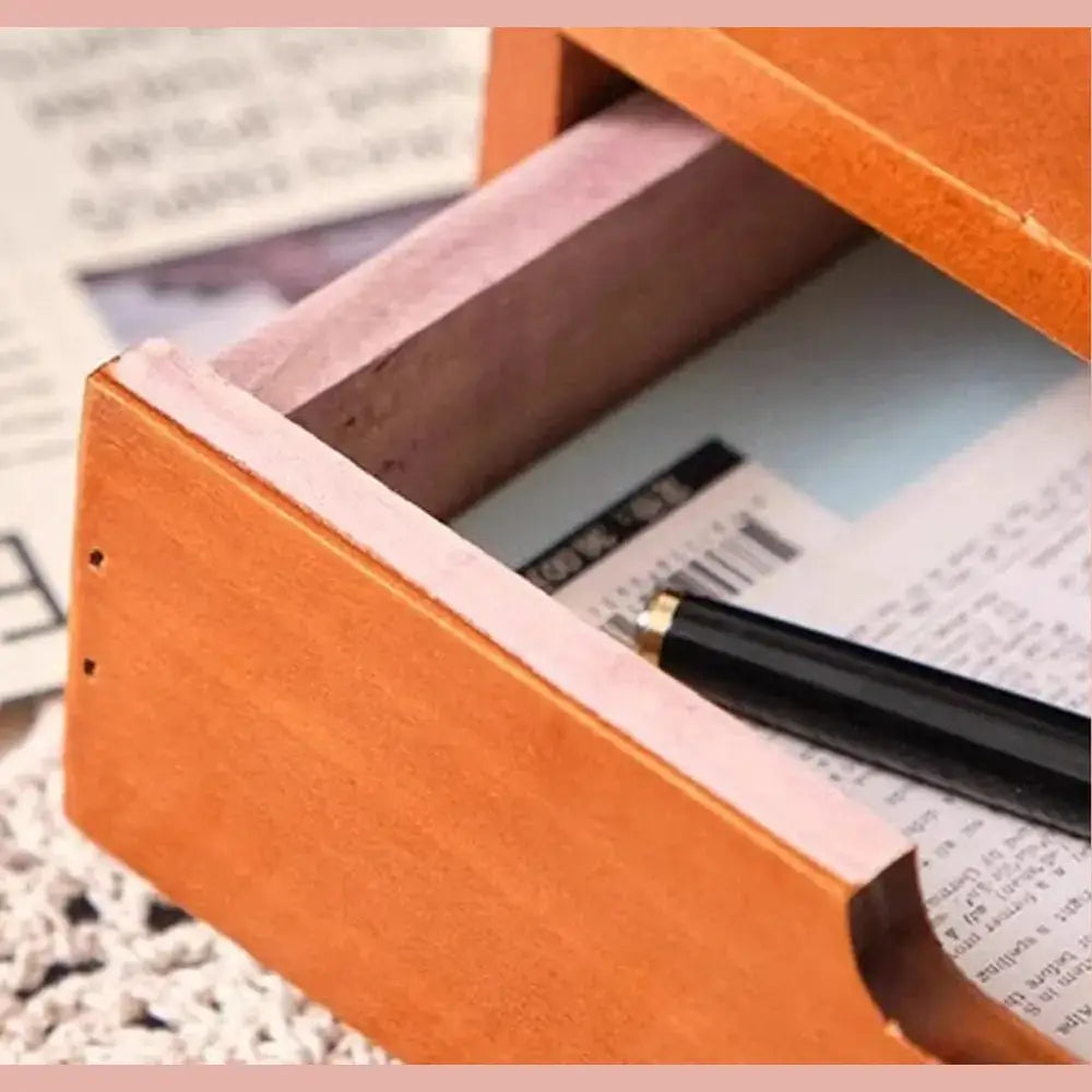Wooden desk organizer with drawers showing compartment for stationery
