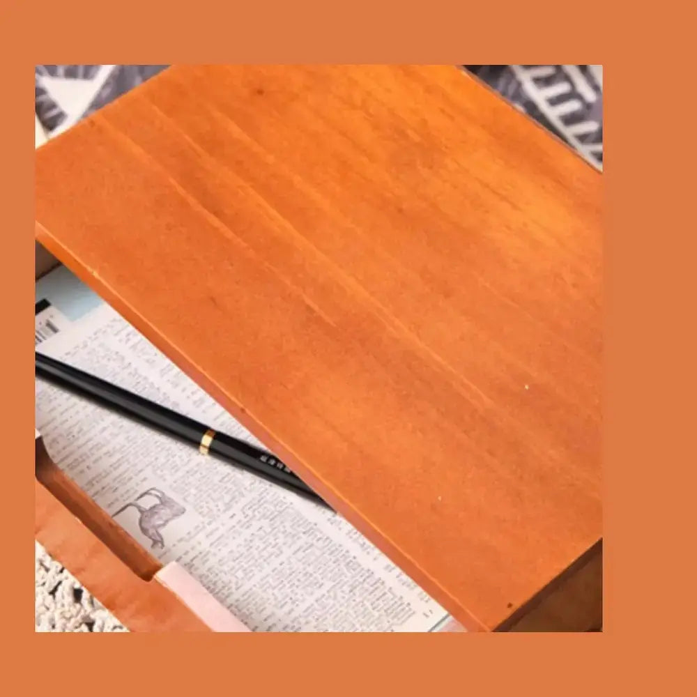 Wooden desk organizer with drawers showcasing a smooth surface and a pen, ideal for keeping essentials neatly organized.