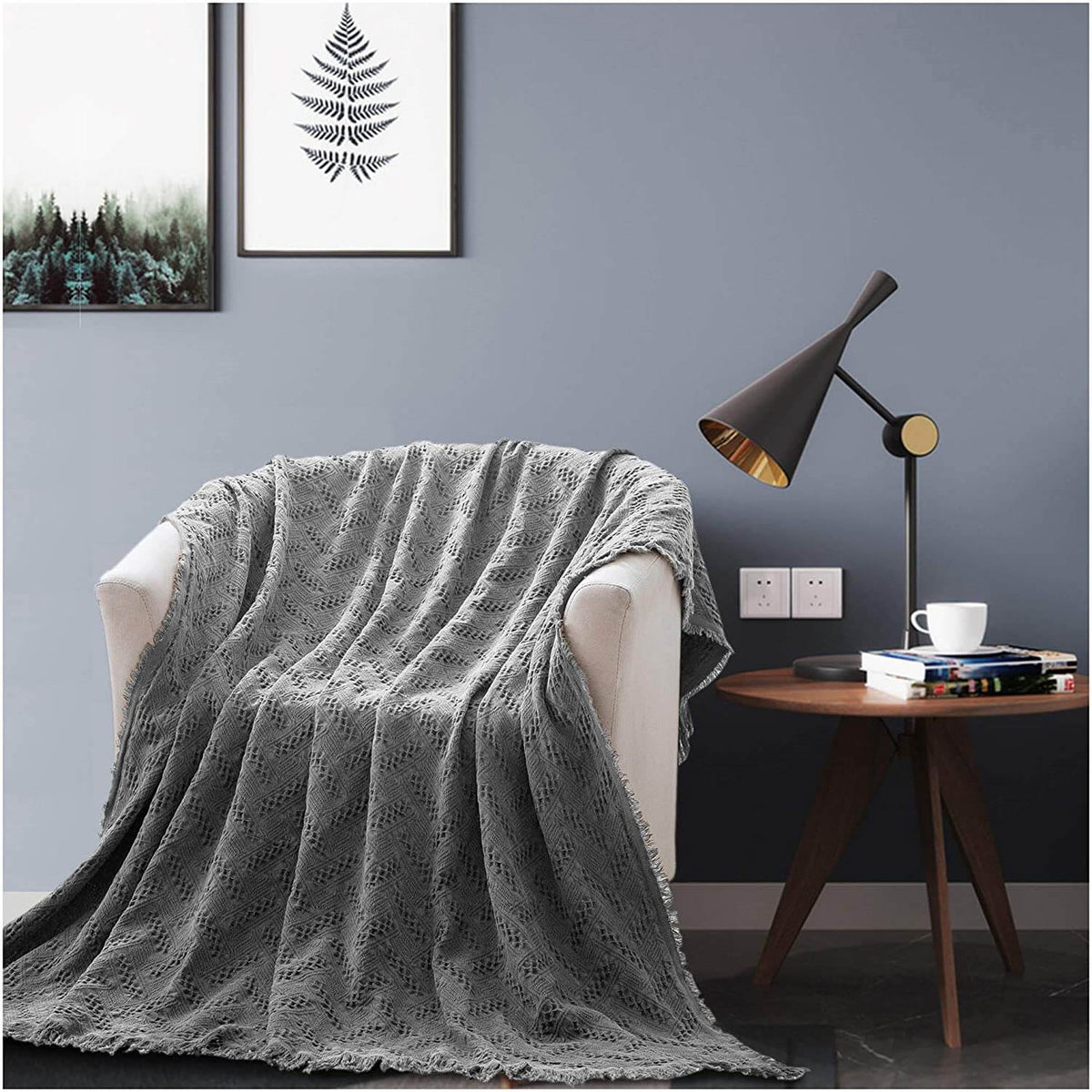 Kasentex 100% cotton knit throw blanket in charcoal grey draped over chair, 60 × 50 in