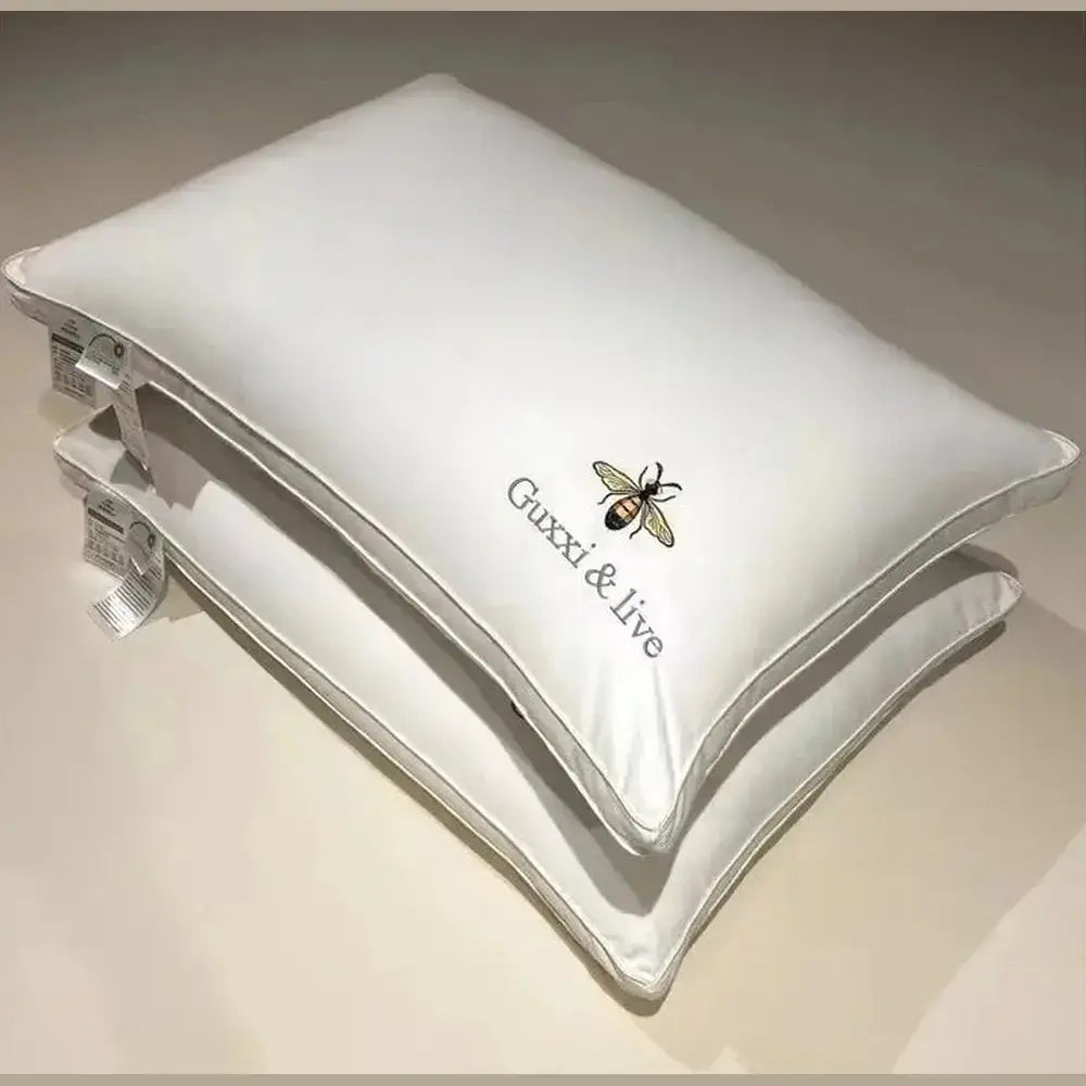 Cervical massage pillow in white, showing the plush cover fabric up close.